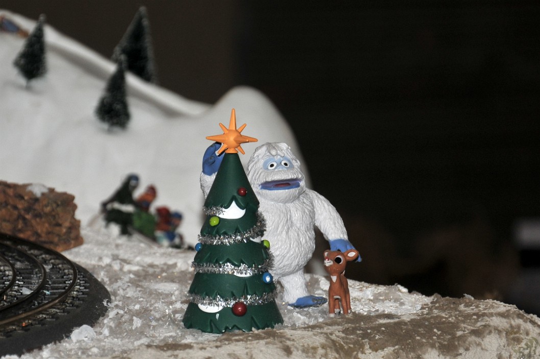Abominable Snowman Decorating a Christmas Tree Abominable Snowman Decorating a Christmas Tree